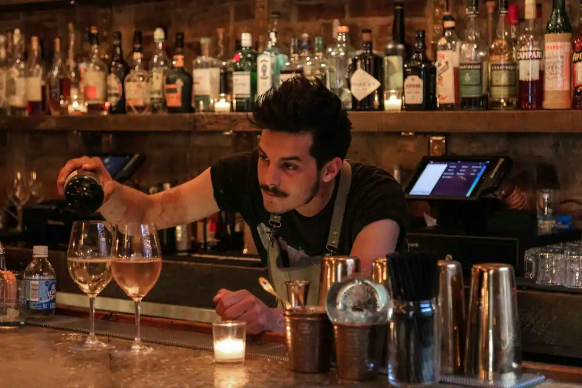 Urban Cowboy Public House Bartender Pouring Spirits