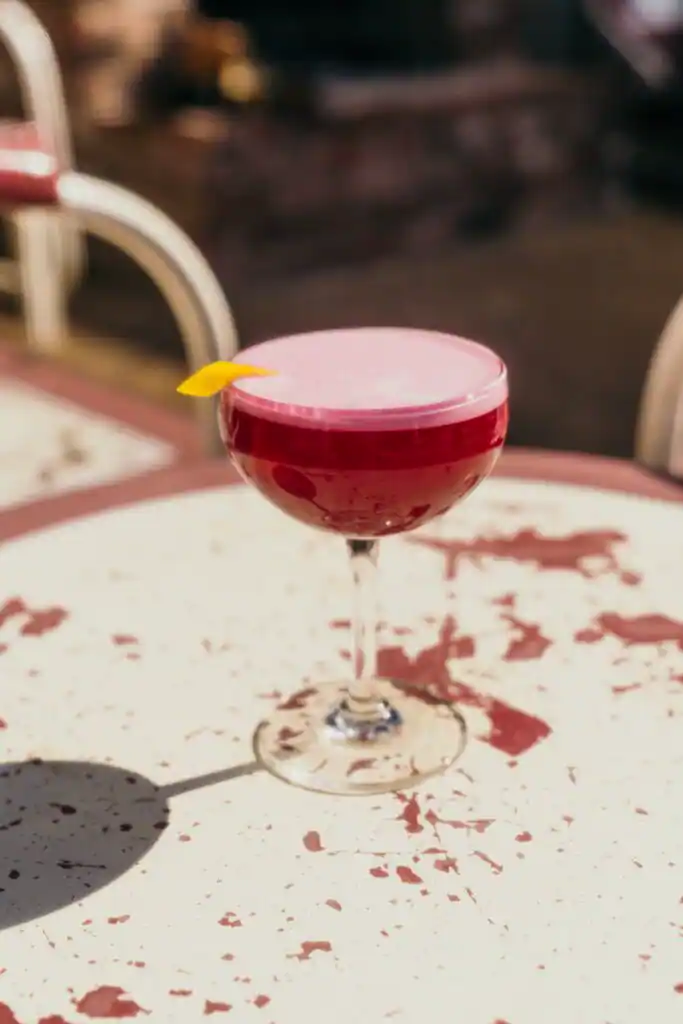 red drink over a white table